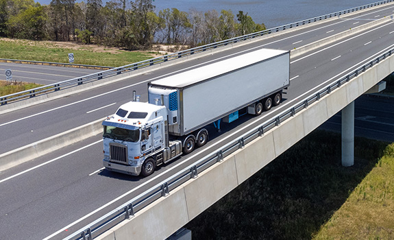Semi Trailer Truck Crossing a Bridge
